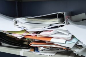 Employer piled up paystub paperwork